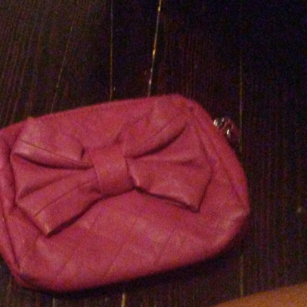 A dark pink purse